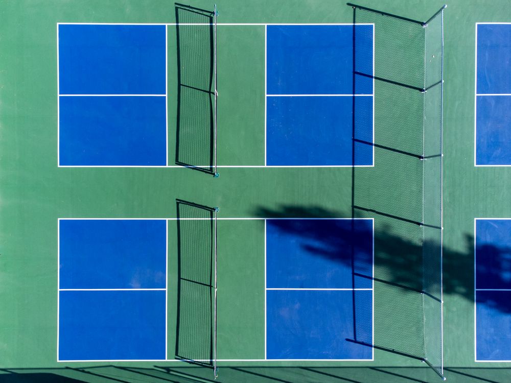Aerial view of blue and green outdoor sport courts