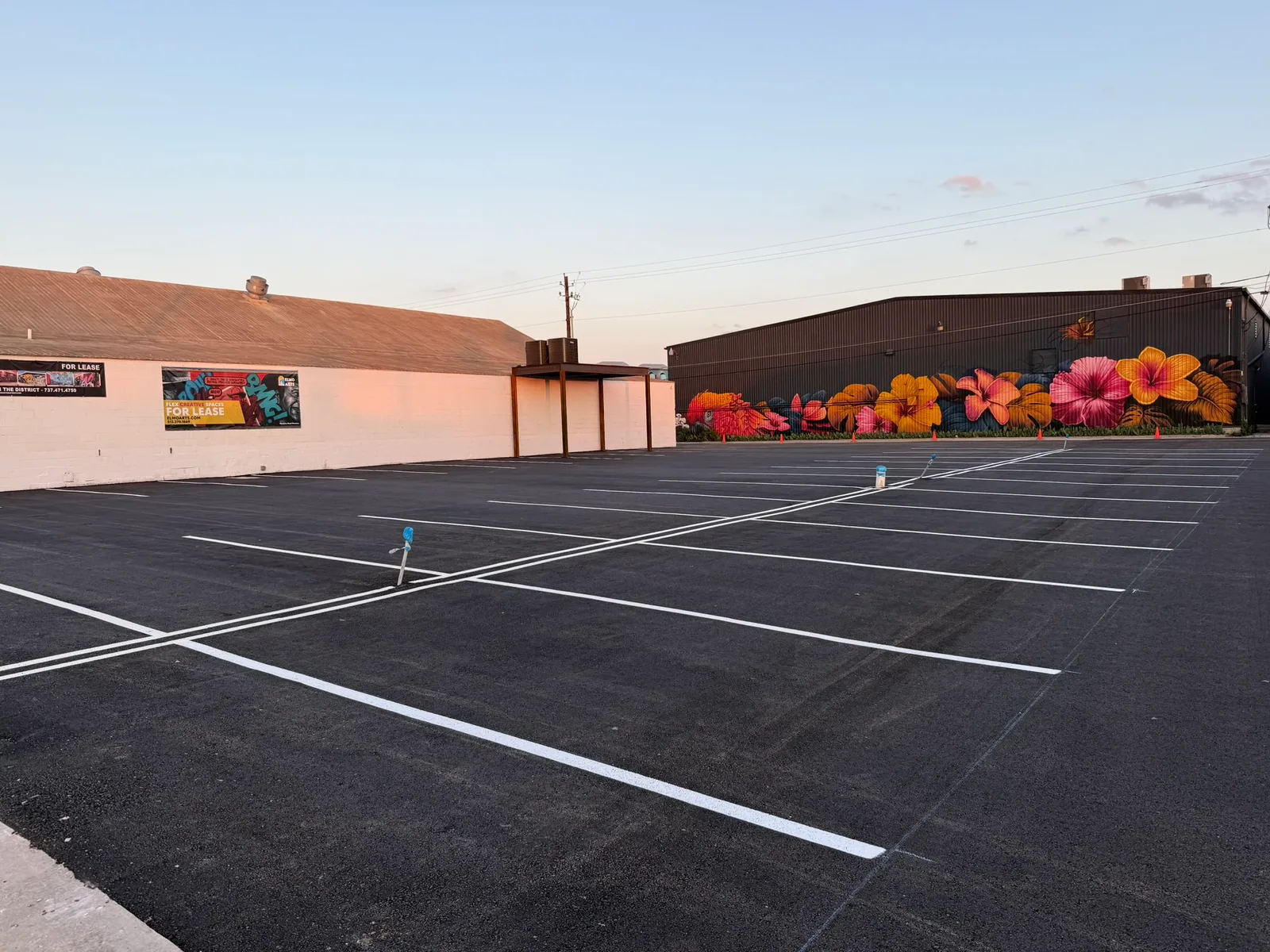 Fresh white parking stall lines on a commercial lot