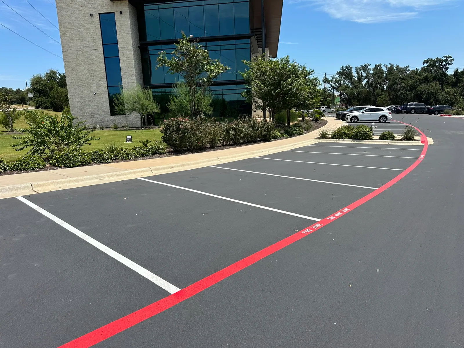 Fresh red fire lane striping and white parking lines